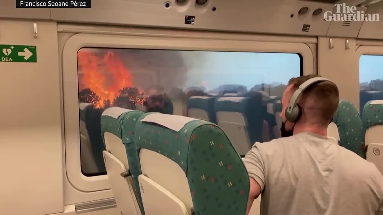 Spain heatwave: passengers struck in train surrounded by wildfires