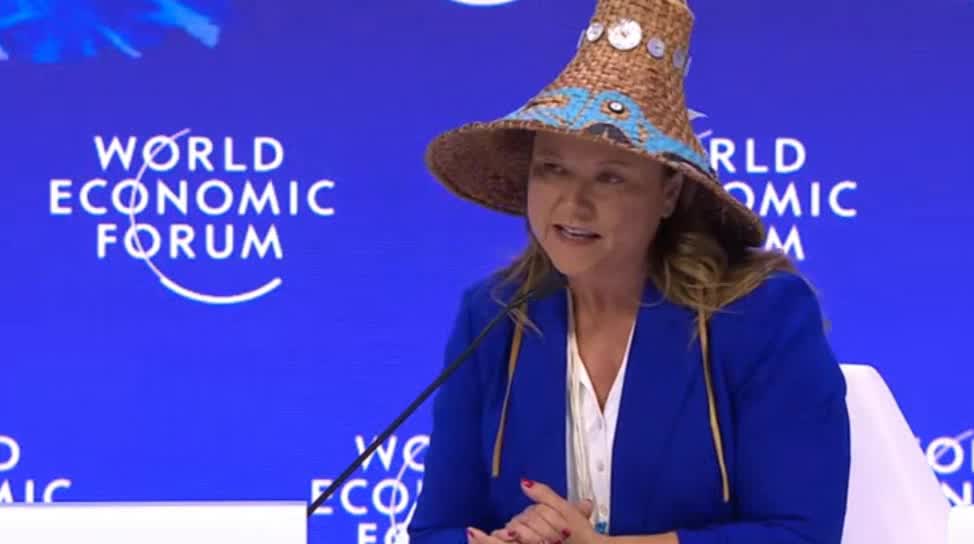 The crisis is also "spiritual," a woman with a hat added
