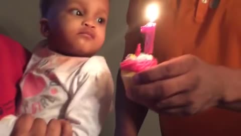 Baby Slaps Birthday Candle Instead of Blowing It