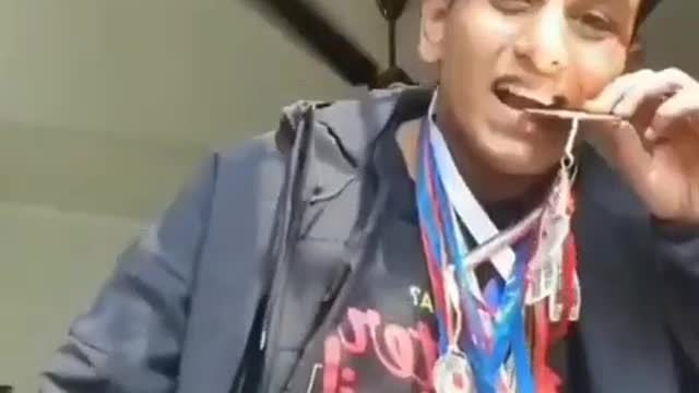 boy showing his medals meme