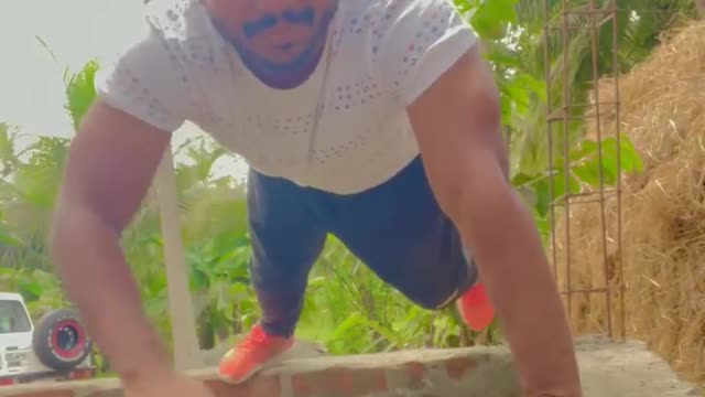 Guy Performs One Legged Pushups on Surface While Balancing His Hands Over Thin Rope in AiR