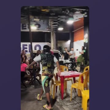 Maloka taking a stroll on the street and watching the people at Boteco