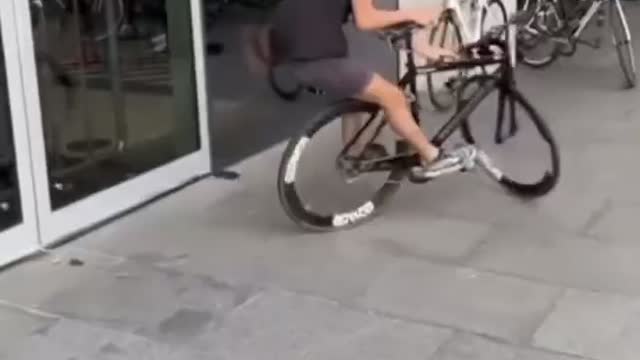 street guy playing with bike