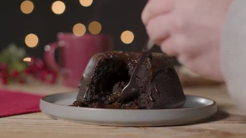 Close Up Shot of Hand Using Fork to Take Piece of Christmas Chocolate Cake-A close-up shot of a hand