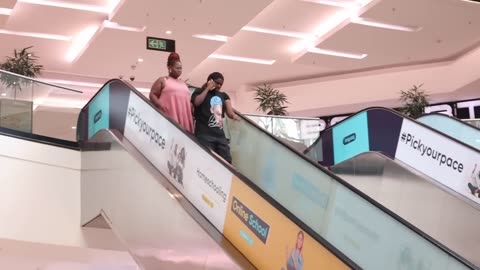 Girls watching man's ... MAN THONG PRANK ON THE ESCALATOR...