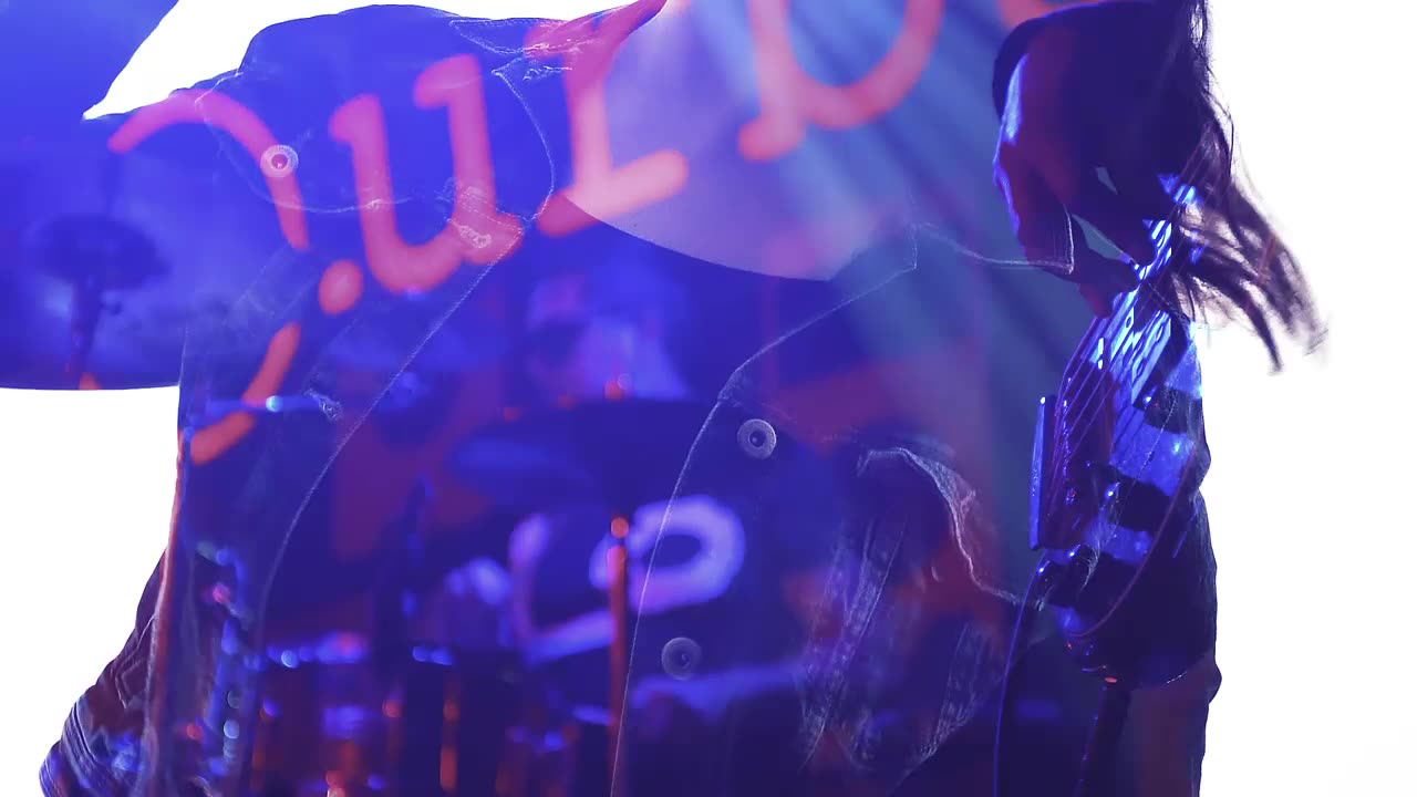 Double exposure video of a person and a rock band