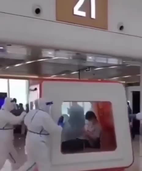 CHINA - COVID police is escorting a citizen who tested positive in a cage