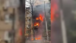 Building burns in Kyiv following Russian airstrikes