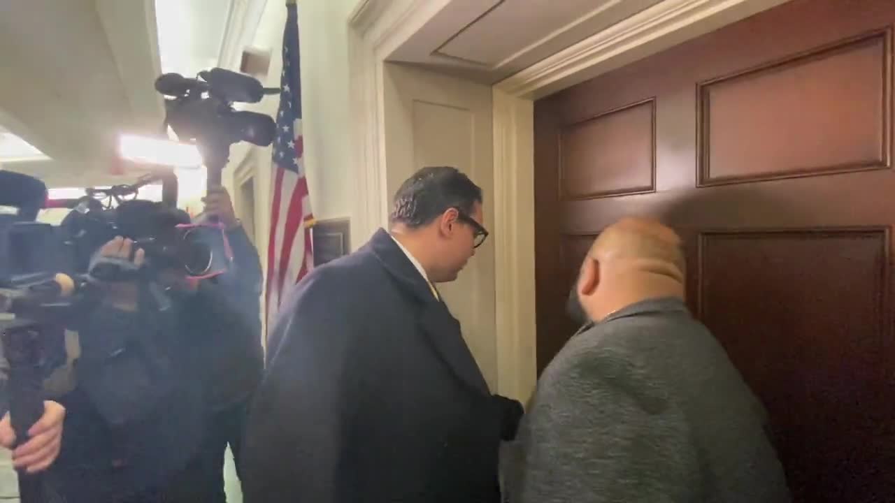 Rep. George Santos Slips on Newspaper While Being Asked About Resigning