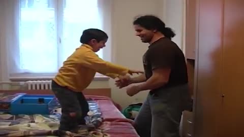 a little boy who trains with his father in a funny way