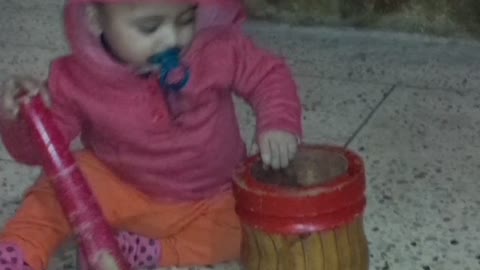 Cute baby trying to help his mother in kitchen work