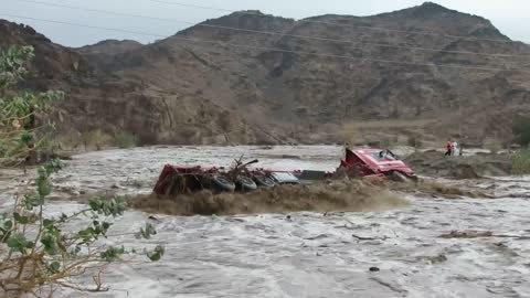 A brave man stand in flood water