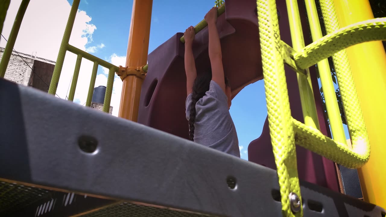 Young girl doing a pull up