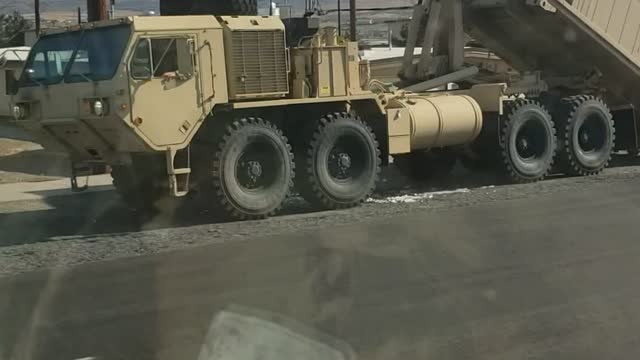 Loading The Heavy Containers on The Truck