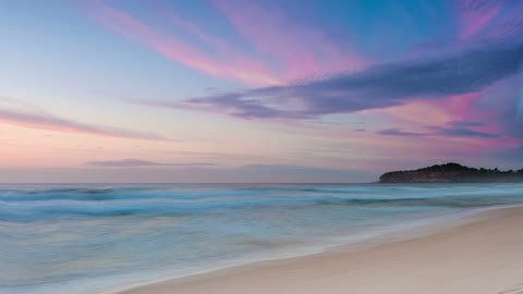 A Purple Pink And Light Blue Sky At Dawn Over A Beach Free To Use Video (No Copyright)