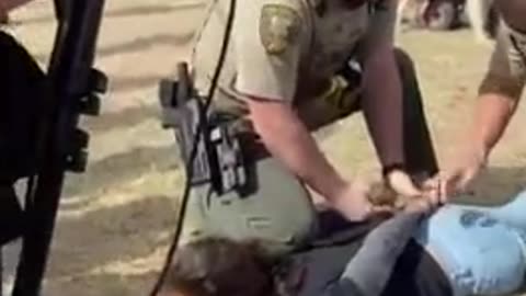 A libtard gets arrested at Trump’s rally.