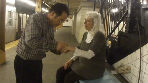 Luodong Massages Cute Grey Haired Grandma In Subway Station