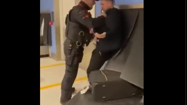 Tommy Robinson arrested upon return to England for "breaching airport security".