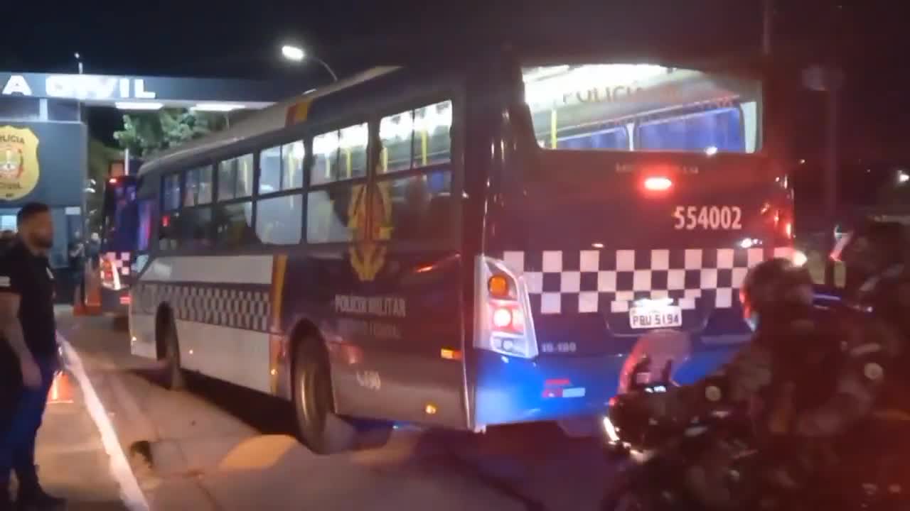 Busloads of arrested Brazilians rounded up by security forces