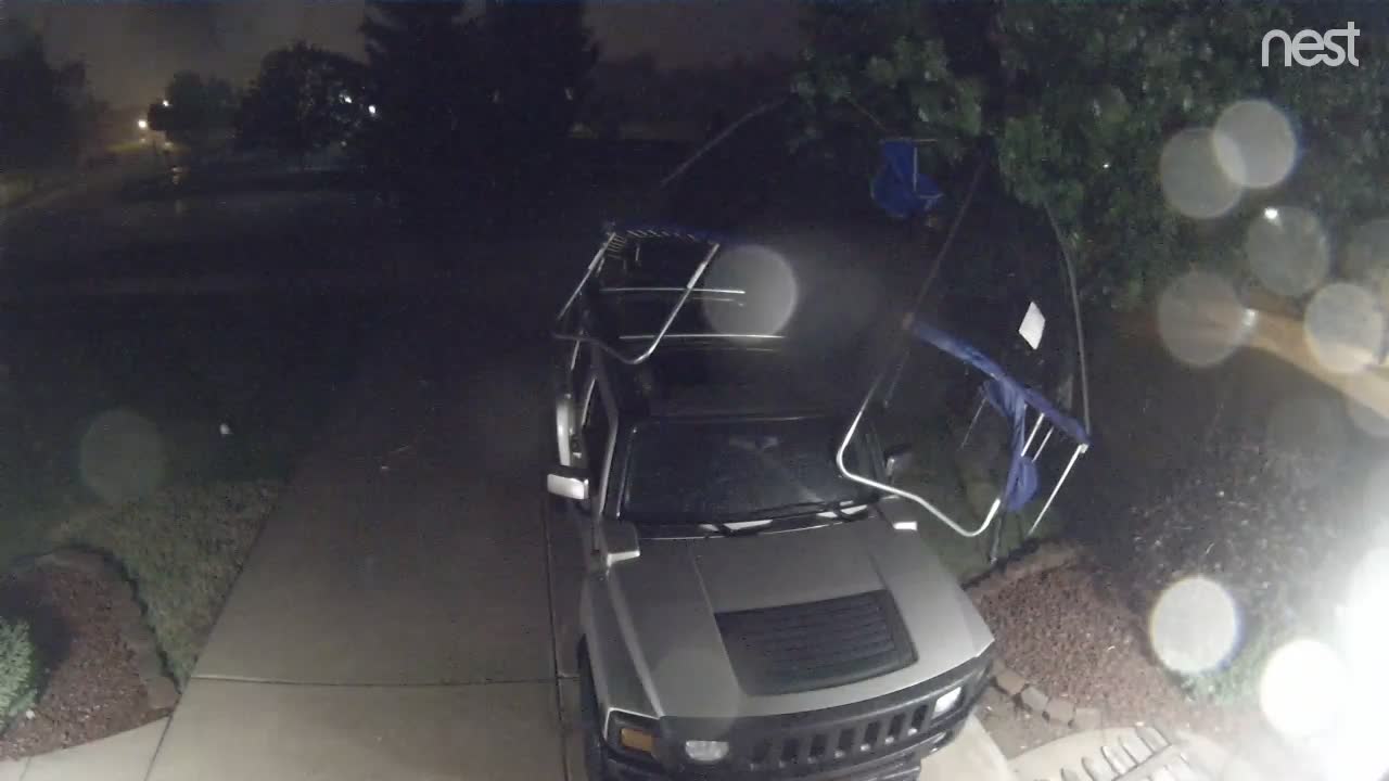 Wind Blows Trampoline onto Hummer SUV