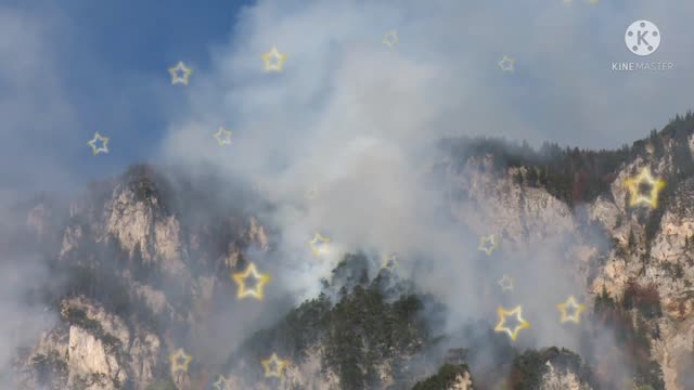 Smoke billows from the mountain.