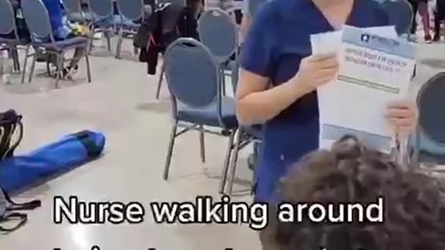 Nurse walking around asking who wants the Vaccine