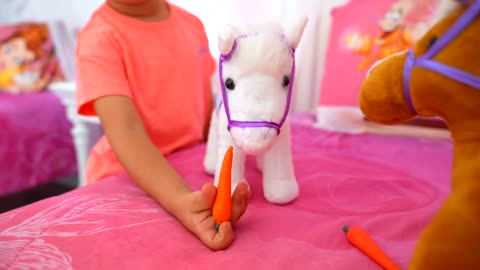 Diana and Roma Plays with toy horses