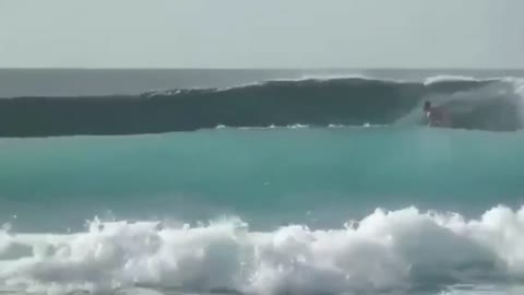 Surfer Pushed A Man Off His Surfboard While Riding A Wave