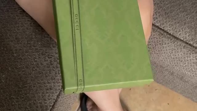 Guy surprises his girlfriend with Gucci socks and she explodes with anger.