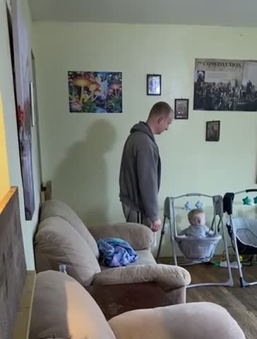 Wild 1 year old rocking himself in the swing that he climbed in by himself