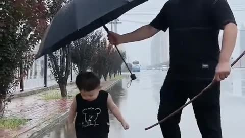 funny cute kid in rain