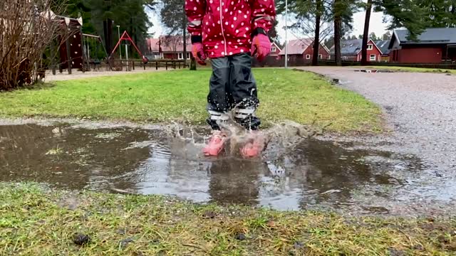 child playing in rain