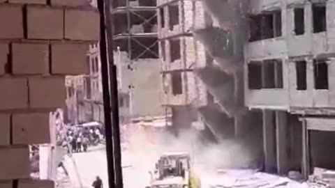 Buildings Collapse Next To Crowd