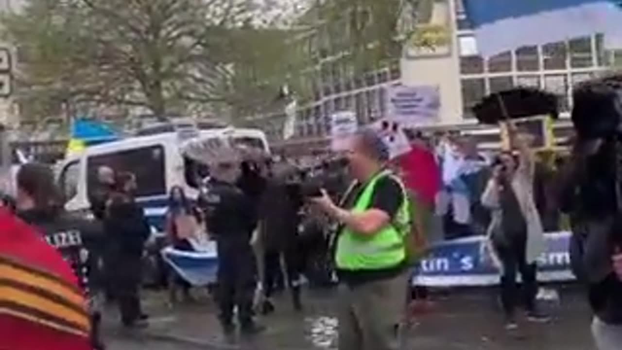 Cologne, Germany - WWII Victory day procession interrupted by people with Ukrainian flags