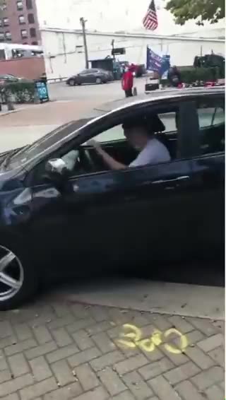 Karma Strikes Again: Man Spits on Trump Flag, Crashes Into Pole