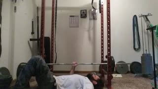 Single arm barbell floor press