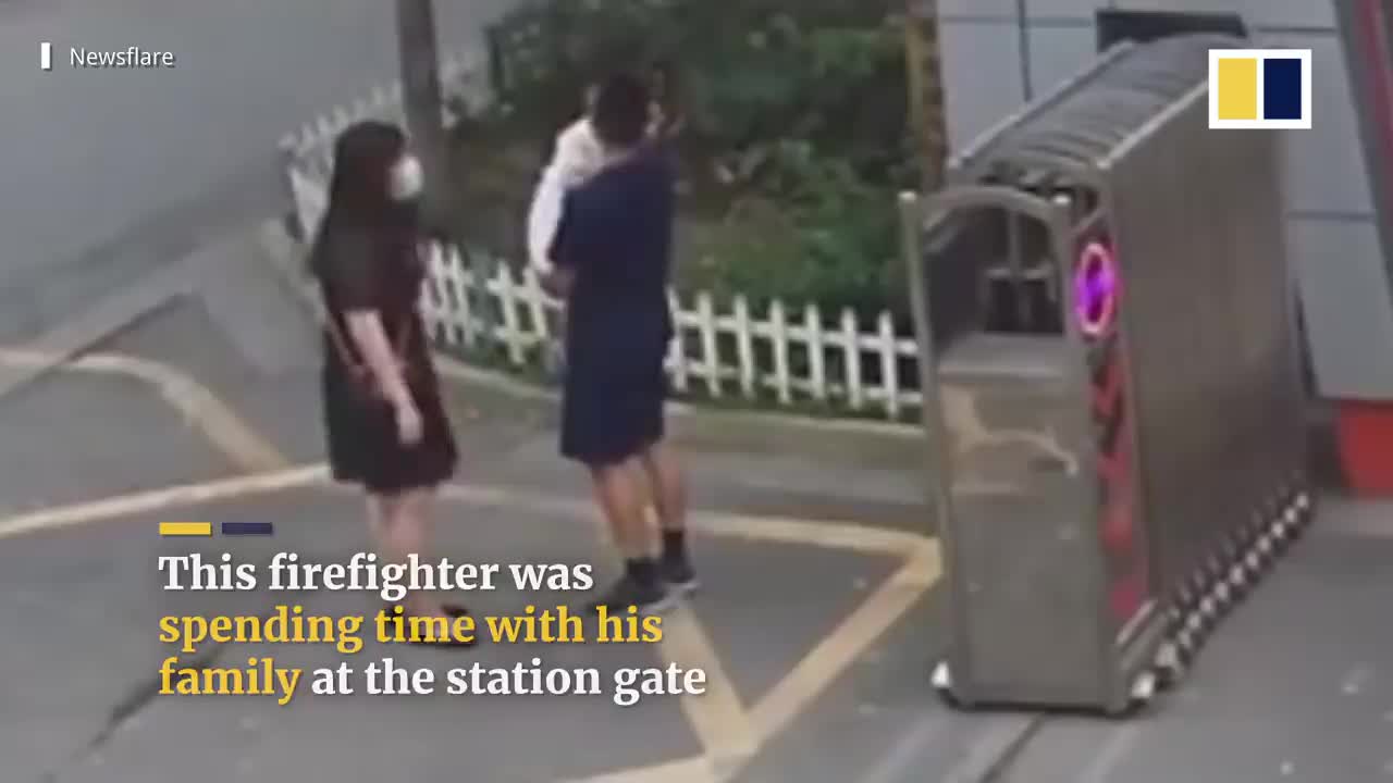 station with daughter in his arms