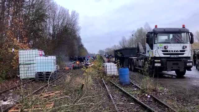 'Go away': French police clear migrant camp