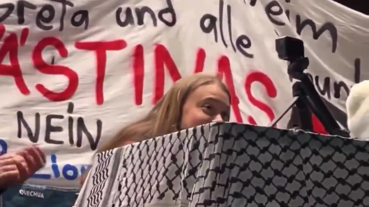Climate change activist turned anti-Israel activist Greta Thunberg laughs as she