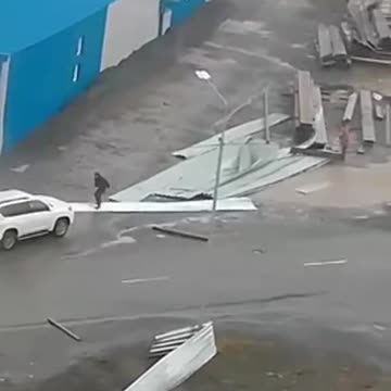 Flying Debris Hits Car