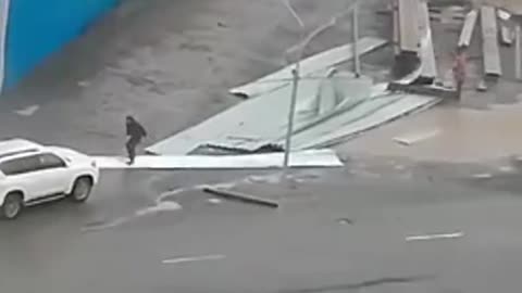 Flying Debris Hits Car