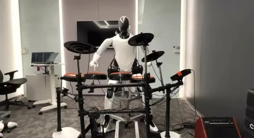 The humanoid robot CyberOne is playing a drum set without missing any beat.