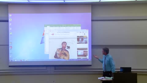 Math Professor Fixing Projector Screen