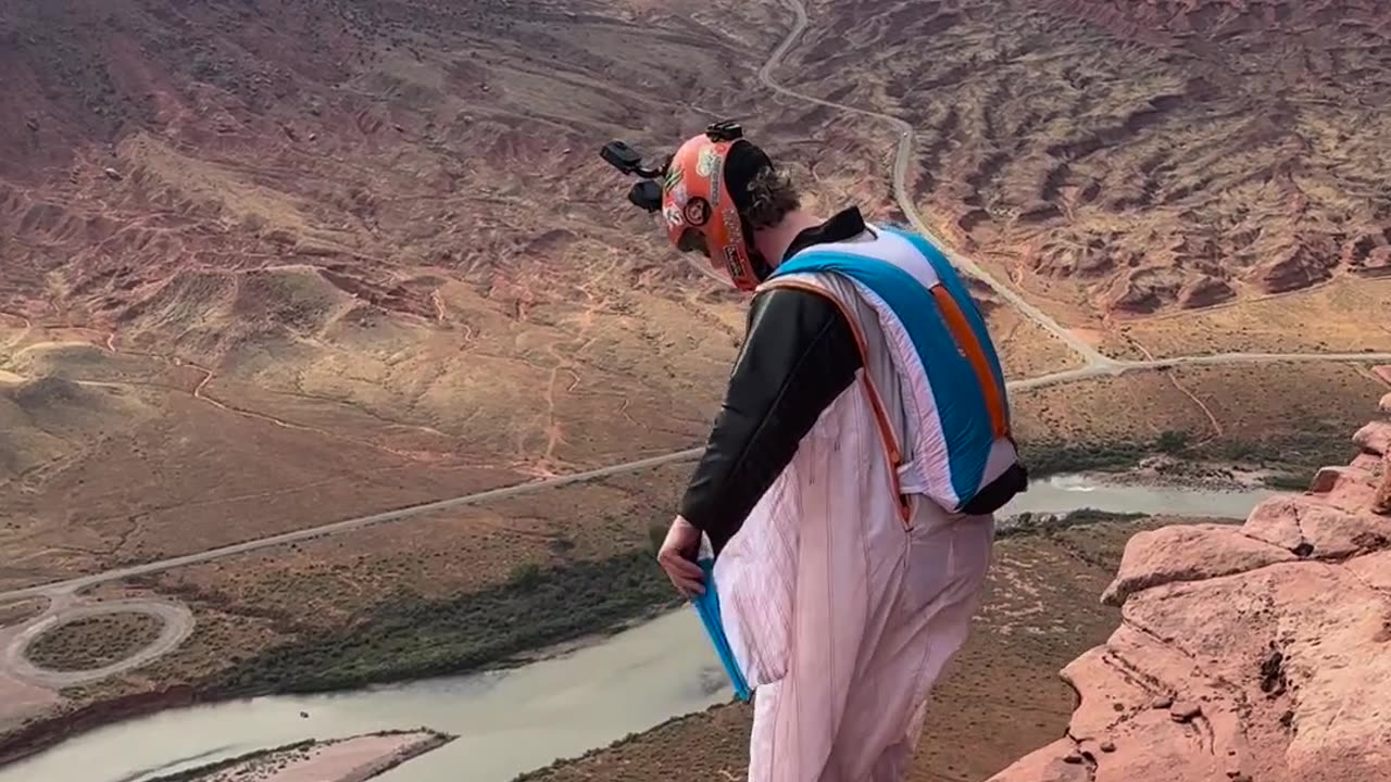 Man jumps off a cliff