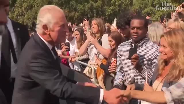 King Charles III greets crowds outside Buckingham Palace