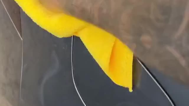 There are some mud stains on the car after the rain, which can be solved by a towel.