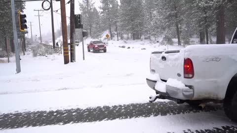 Cars sliding on Maple Lane after recent snowfall in Big Bear, CA