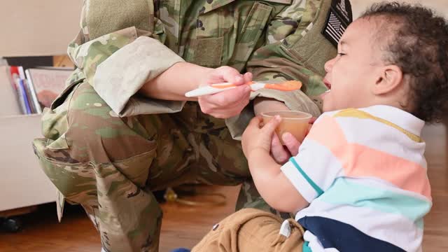 Mother Feeding Kid