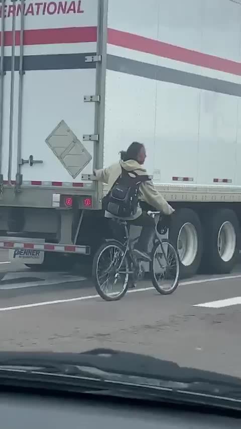 A Toronto Man On A Bike Was Caught Hanging Onto The Back Of A Truck While Cruising Down The Road