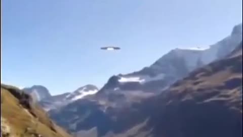 UFO APPEARS IN THE MOUNTAINS AT TIME